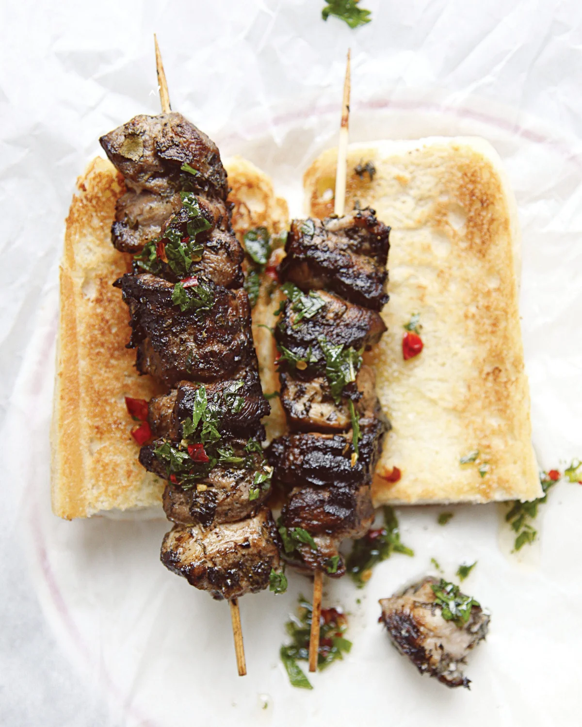 Pork spiedies on a toasted Italian hoagie roll
