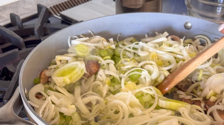 stirring veggies in pan