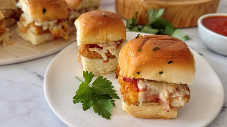 Chicken parmesan sliders on plate with parsley
