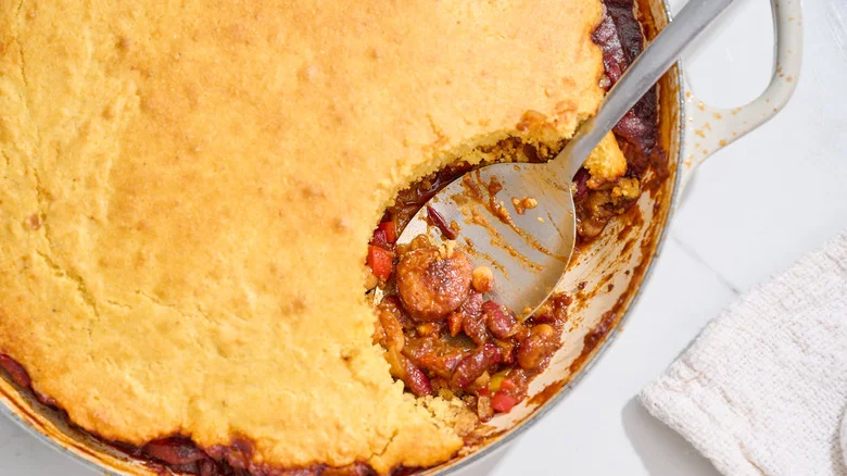 beanie weenie casserole with a slice taken out of it