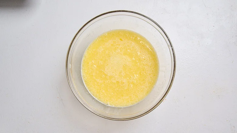 eggs and milk whisked together in a bowl