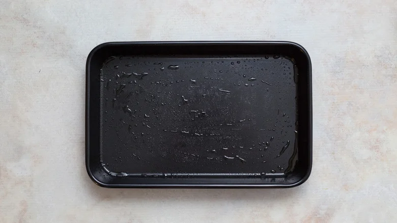 greased baking dish on table