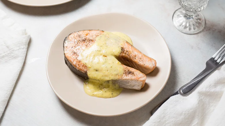 salmon steak served on table