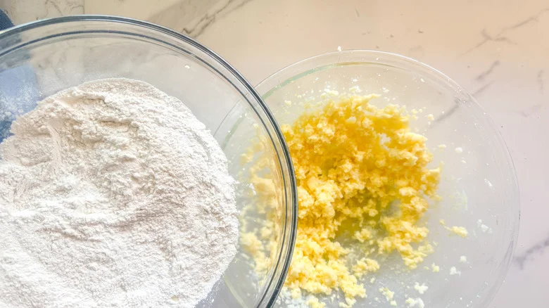 adding flour to bowl