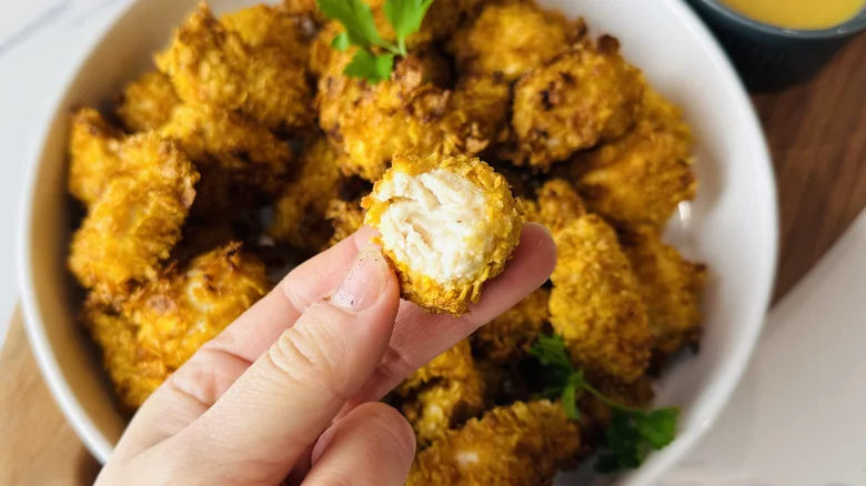 Bite taken out of popcorn chicken