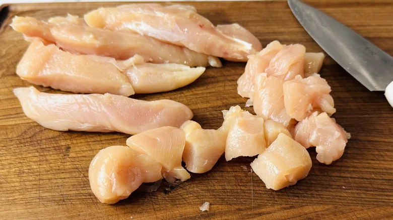 Cutting chicken into pieces