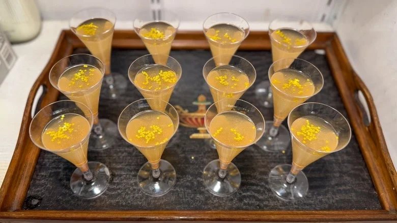 Champagne jell-o shots on tray in refrigerator