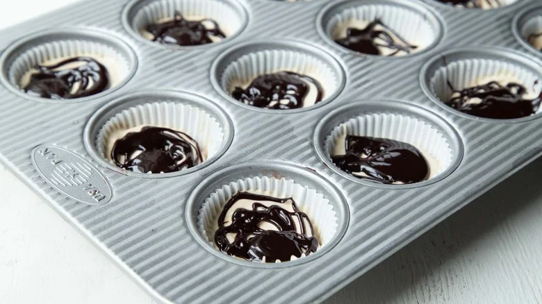ice cream and fudge sauce in muffin cups