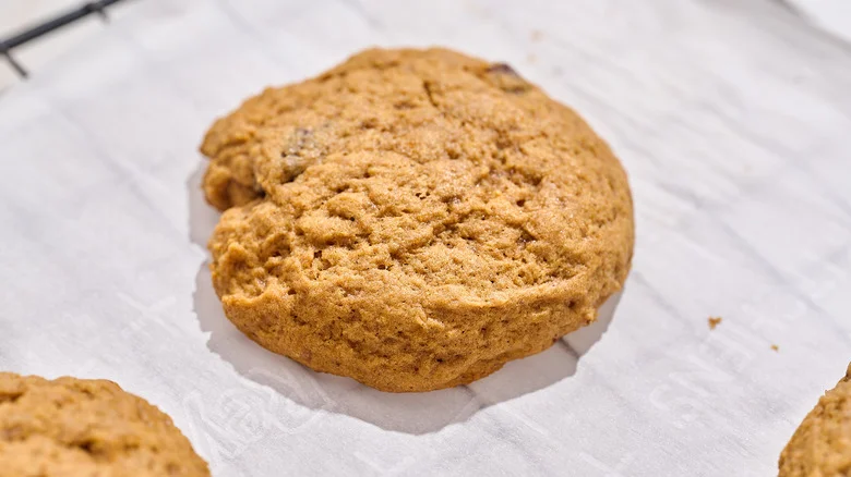 pumpkin cookie cooling on a wire rack