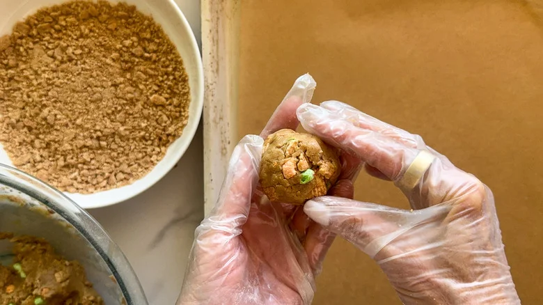 hand holding ball of dough