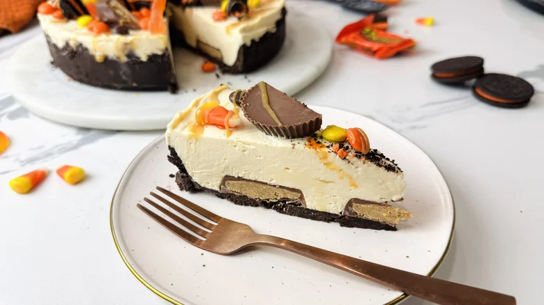 Halloween candy cheesecake slice on plate