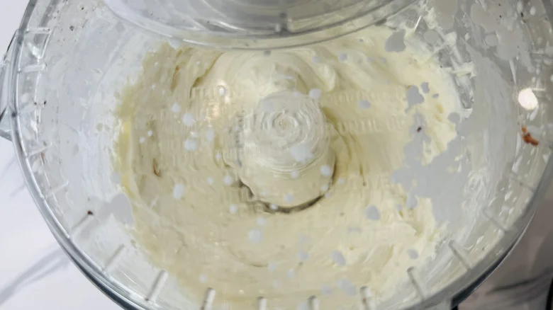 Cream cheese mixture in food processor with lid on