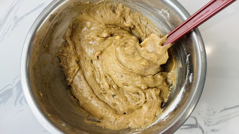 Blondie batter with walnuts in bowl