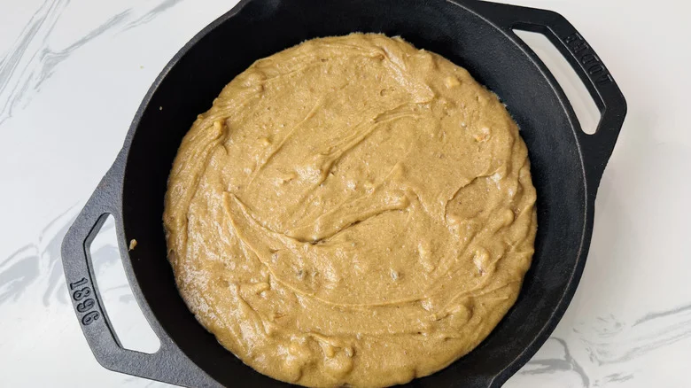 Blondie batter spread out in skillet
