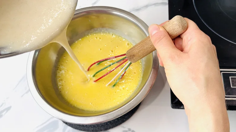 Tempering egg yolks in bowl