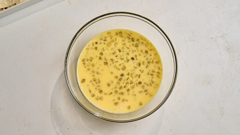 chiles stirred into the egg mixture