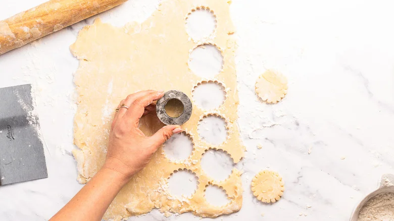 Cutting shortbread cookies with cookie cutter