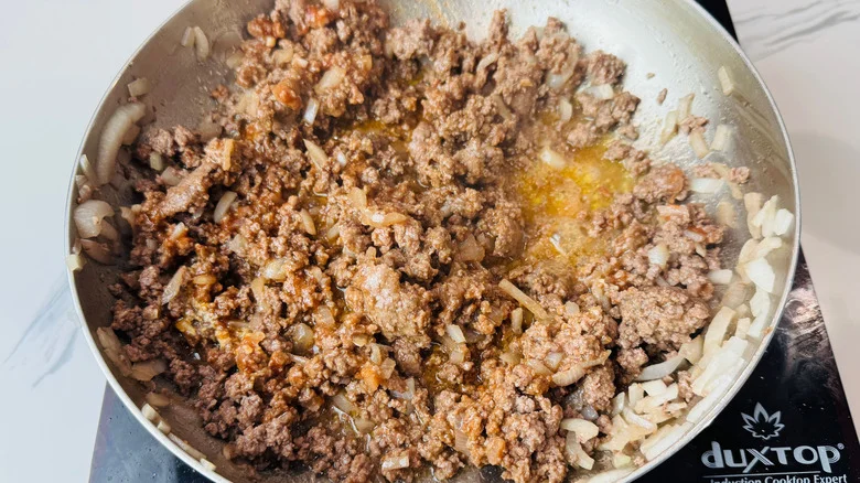 Beef and onion mixture in skillet