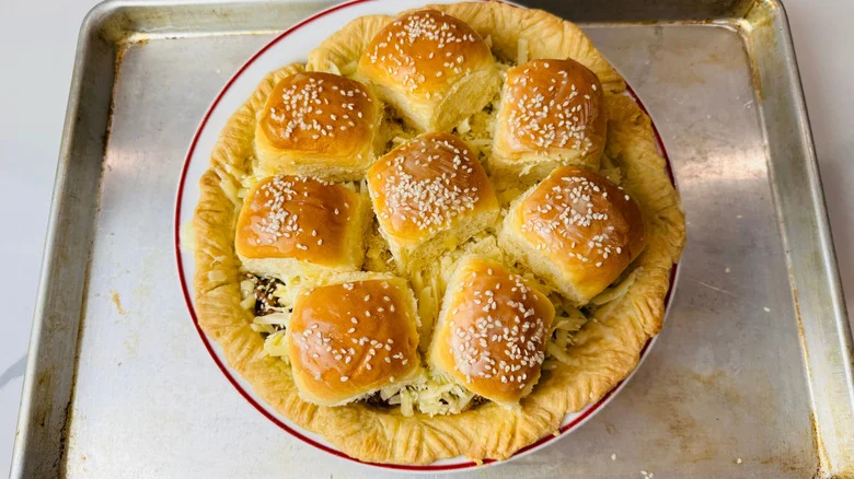 Cheeseburger pie topped with sesame slider buns