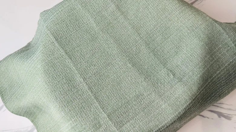 Bowl covered with kitchen towel