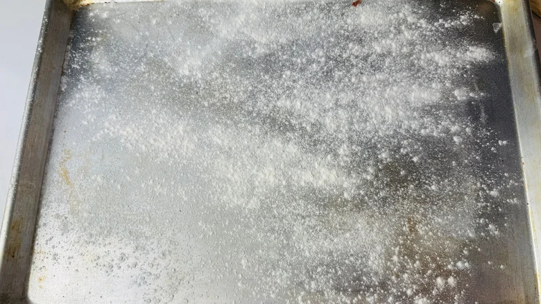 Baking sheet with sprinkling of flour