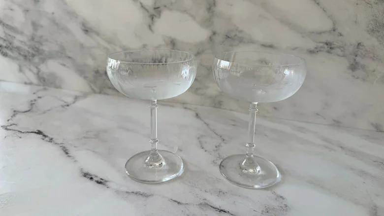Chilled coupe glasses on countertop