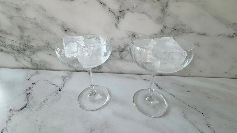Coupe glasses filled with ice