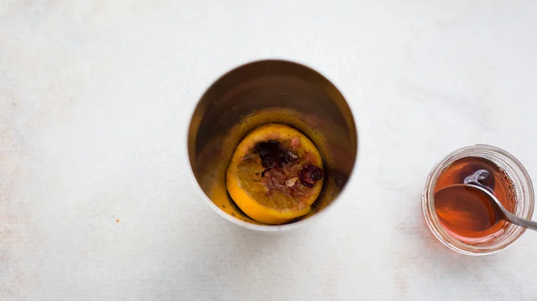 muddled fruit in cocktail shaker
