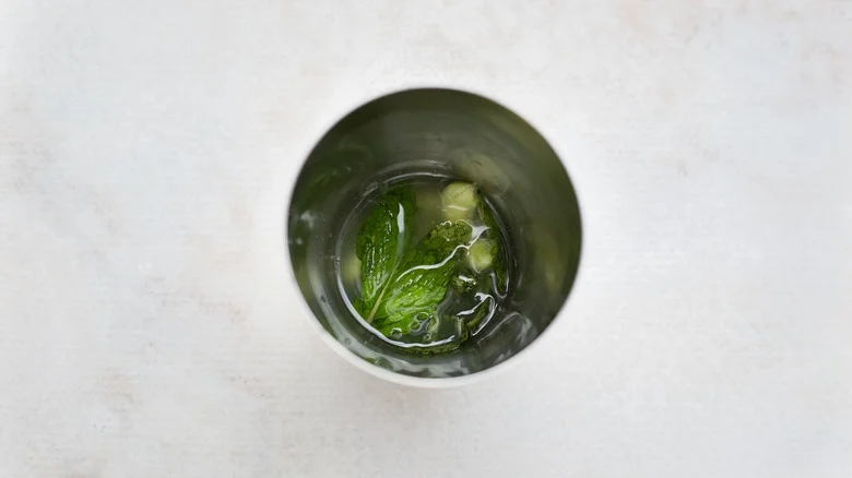 cocktail ingredients in metal shaker