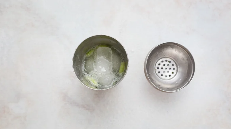 shaken cocktail in open shaker
