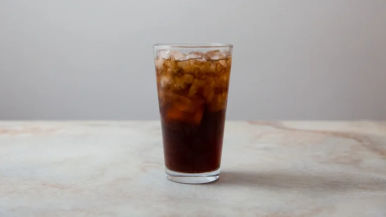 glass of cola on table