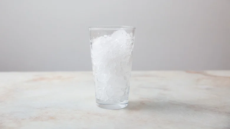 glass of ice on table