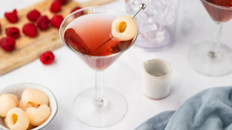 Raspberry lychee martini with whole lychee garnish