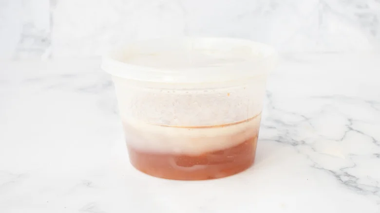 brown frozen substance with white layer on top