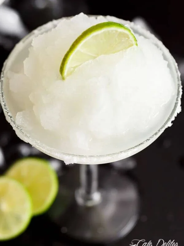 Frozen Margarita Slushy blends the original Margarita made with Tequila and fresh lime juice with ice cubes to make a refreshing icy drink!